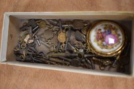A box of small clock/fob watch keys and a miniature Limoges display plate.