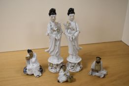 A pair of 20th Century Chinese porcelain geisha studies, measuring 26cm tall, and three Shiwan