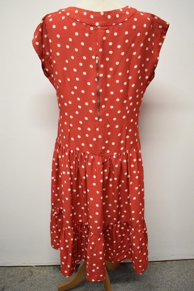 A 1950's red dress, having white polka dot pattern, tiered skirt and rear metal zip, larger size. - Image 2 of 5