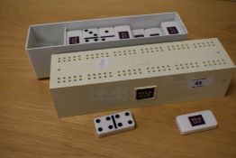 A set of vintage Silk Cut dominoes and cribbage board