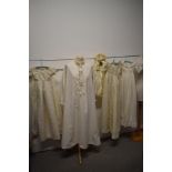 Three antique babies gowns (some AF, darns etc) a bonnet, an early 20th century coat and an adults