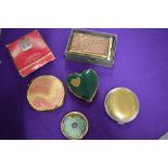 Five vintage compacts, including one gold plated L'aimant 75 year anniversary compact and a