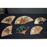 Six vintage paper fans, including BOAC and HongKong tramways collectable fans.