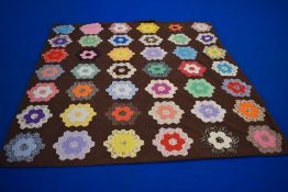 A 1960s hexagonal patchwork duvet cover, around a double in size
