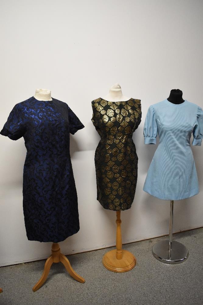 Three 1960s dresses, including two with metallic thread accents and baby blue mini dress with puff