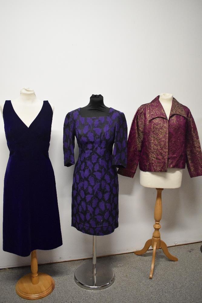 Two purple 1960s dresses and a cerise and gold jacket, having Art Deco styling.