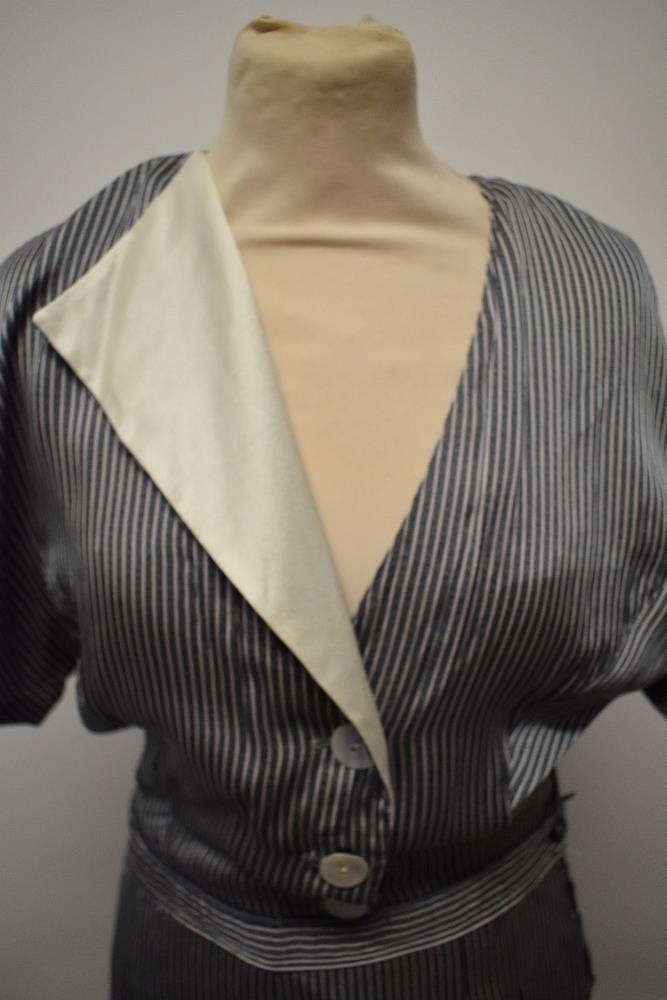 A silky striped vintage jump suit, having contrasting lapel and wide legs. - Image 5 of 7