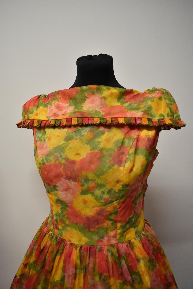 Two 1950s dresses, including vibrant floral dress with full skirt and shawl collar. - Image 4 of 8