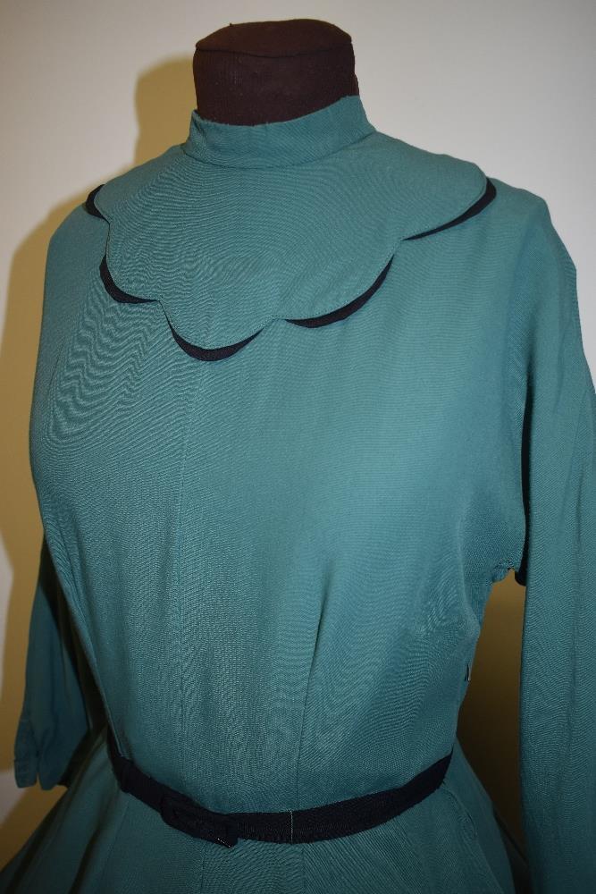 A 1950s green day dress, having black scalloped detail to bodice, high collar, long sleeves, full - Image 4 of 7