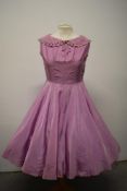 A mauve lightweight taffeta day dress, having portrait collar with cutwork and machine embroidery,