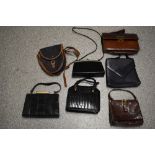 A selection of vintage bags, including reptile skin box bags.