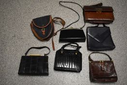 A selection of vintage bags, including reptile skin box bags.