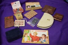 A collection of vintage sewing items, including mending kit for stockings, sharps cases etc.