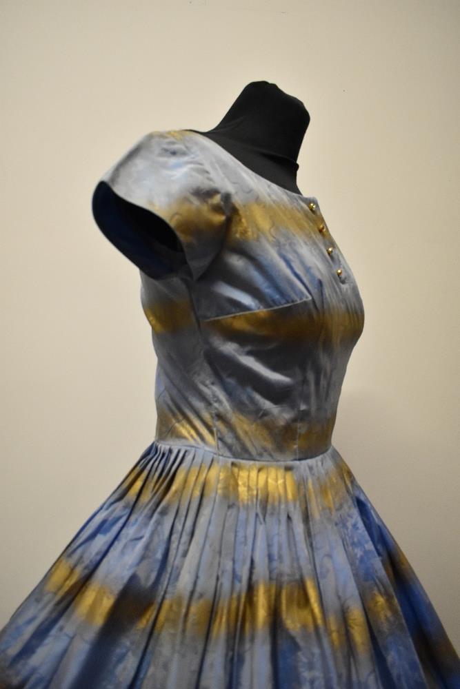 A 1950s blue and gold dress, having full pleated skirt, diamante accents to bodice and rear metal - Image 8 of 8