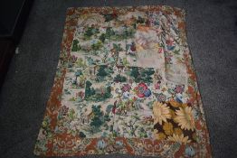 A small patchwork bed throw, using various bark cloths and velvets etc to one side and florals and