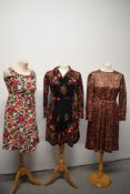 Three 1960s bright floral dresses, including stunning concertina pleated floral and paisley dress.