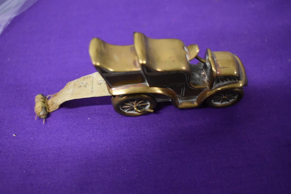 An Edwardian brass measuring tape in the form of a car. - Image 2 of 5