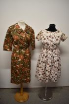 A 1960s autumnal print Trevira dress and a 1950s abstract roe patterned cotton day dress.