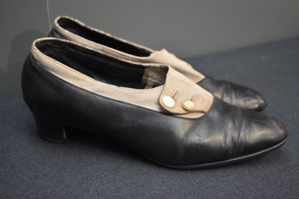 A pair of early 20th century black leather and cream suede shoes, having button decoration and stack - Image 2 of 8