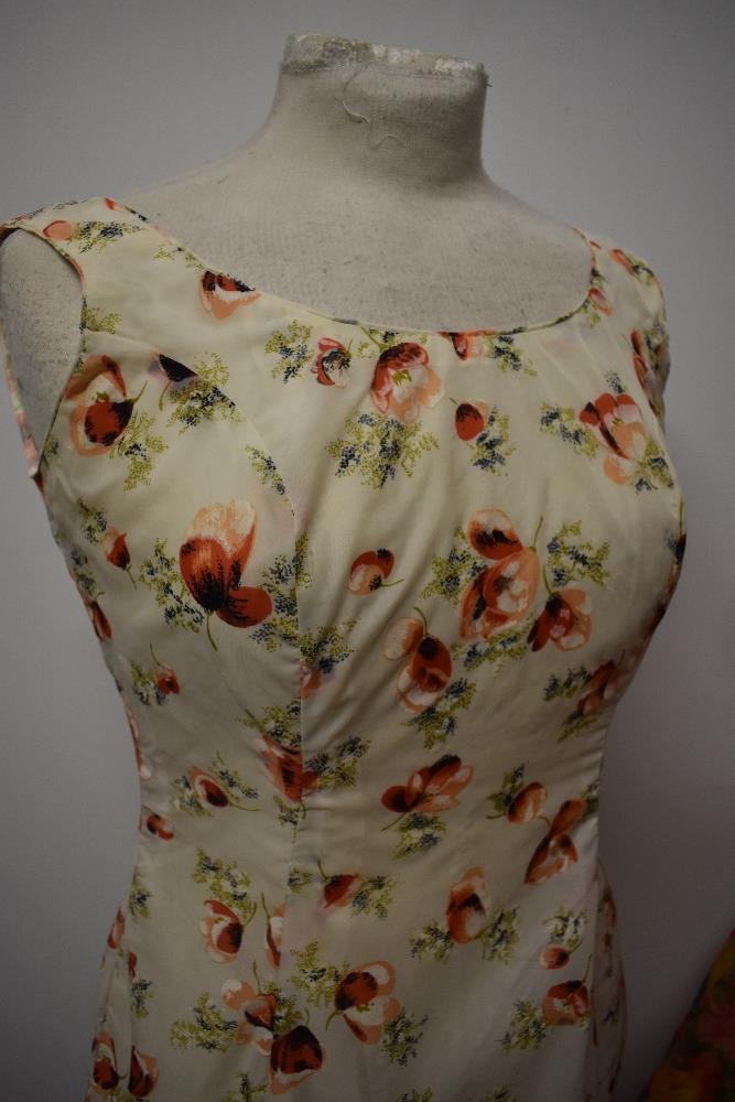 Two 1950s dresses, including vibrant floral dress with full skirt and shawl collar. - Image 8 of 8