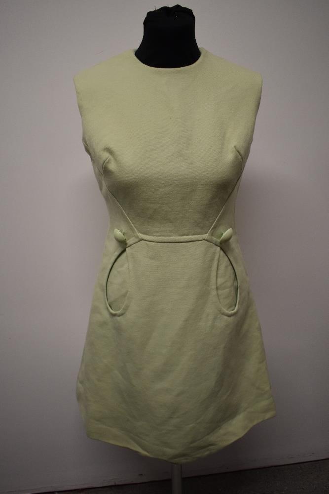 A mint green 1960s mini dress, with looped pockets and large button detail. - Image 6 of 8
