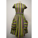 A 1950s 'Little Eve' cotton day dress, having original belt, large patch pockets to front with large