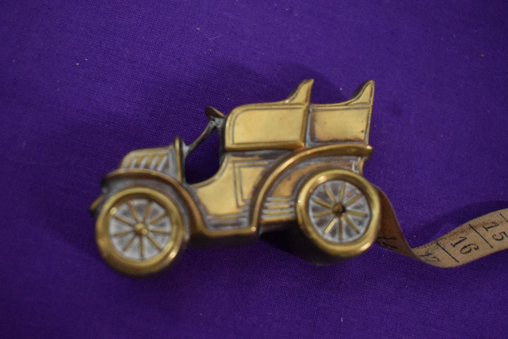 An Edwardian brass measuring tape in the form of a car. - Image 5 of 5