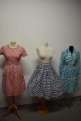 A 1950s abstract patterned textured cotton skirt, a 1960s dress having pink gingham and floral