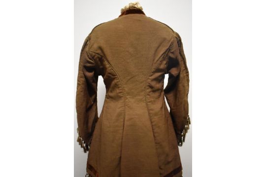 A Brown Victorian overcoat, having velvet trim, tassels to hem and sleeves and silk bow details ( - Image 4 of 17