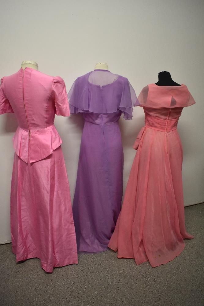 A 1950s pink evening gown with full skirt, a 1960s pink gown with bows to bodice and a 1970s John - Image 5 of 5