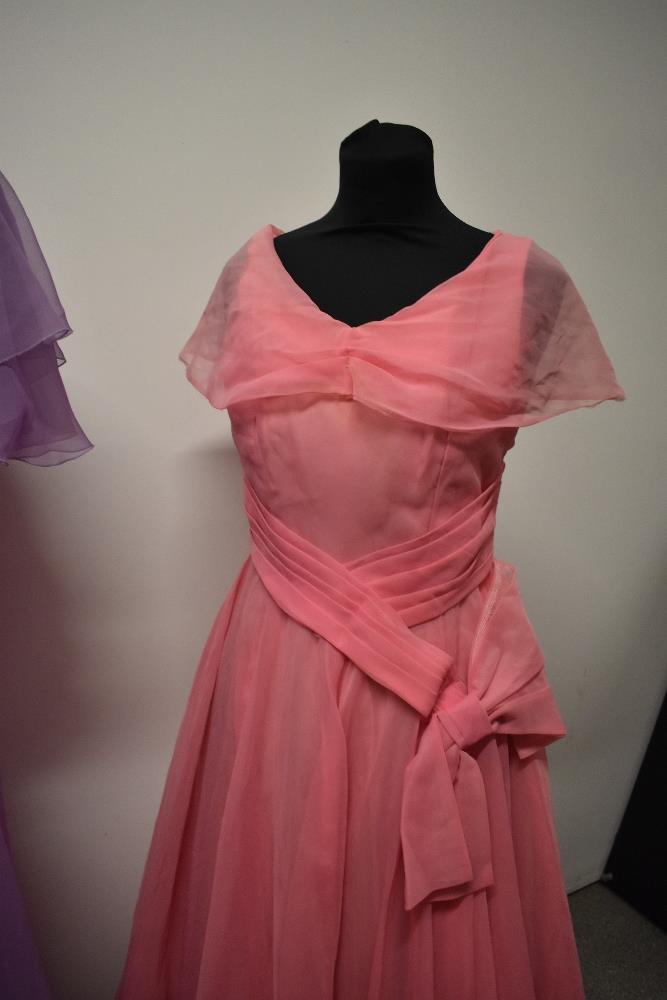 A 1950s pink evening gown with full skirt, a 1960s pink gown with bows to bodice and a 1970s John - Image 4 of 5
