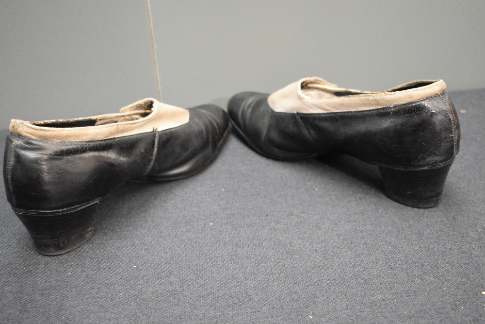 A pair of early 20th century black leather and cream suede shoes, having button decoration and stack - Image 6 of 8