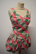 A 1940s pink, green, brown and white seersucker cotton playsuit.