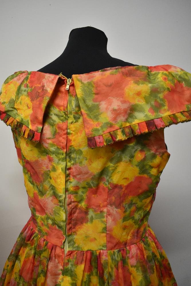 Two 1950s dresses, including vibrant floral dress with full skirt and shawl collar. - Image 7 of 8