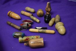 A collection of antique needle cases, thimble holders and pin cushions, including Mauchline ware and