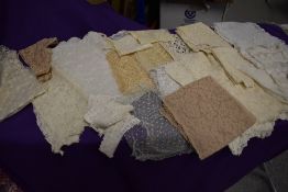 An assortment of mixed antique lace work, tulle and tatting, some scarves and a sleeve included.