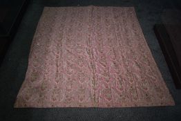 A heavy cotton wool filled rose pink paisley bed cover, around 1930s.
