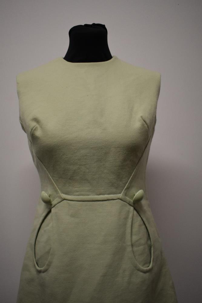 A mint green 1960s mini dress, with looped pockets and large button detail. - Image 5 of 8