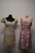 Two 1960s day dresses in pink hues, one having frilled neckline.