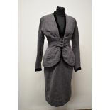 A beautifully tailored deep heather coloured textured wool 1940s skirt suit, having black velvet