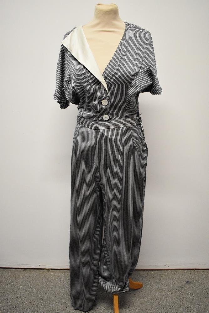 A silky striped vintage jump suit, having contrasting lapel and wide legs. - Image 7 of 7