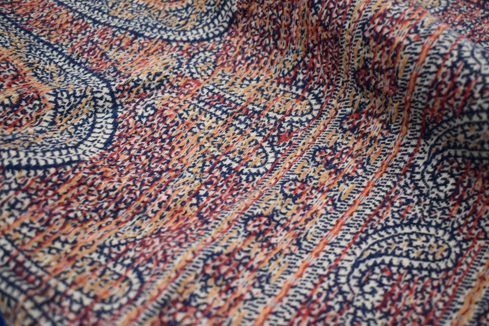 A mid Victorian woven Paisley Kirking crinoline shawl, with cream ground and blue, red and ochre - Image 4 of 10