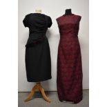 A 1950s black wiggle dress with mahogany toned mink trim and a floor length 1960s evening gown.