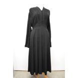 A late 1930s / 1940s black crepe day dress, having braiding to front with sequins, panelled skirt,