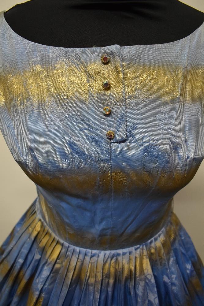 A 1950s blue and gold dress, having full pleated skirt, diamante accents to bodice and rear metal - Image 4 of 8