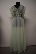 A vintage mint green nylon nightdress, having double layered skirt and floaty lace to bodice,