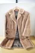 A vintage coney fur coat, medium size.