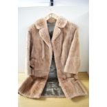 A vintage coney fur coat, medium size.