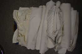 A collection of vintage and antique bed linen, table linen and huckaback hand towels.
