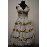 An amazing novelty print cotton day dress, having pleated skirt, with pattern of Victorian style